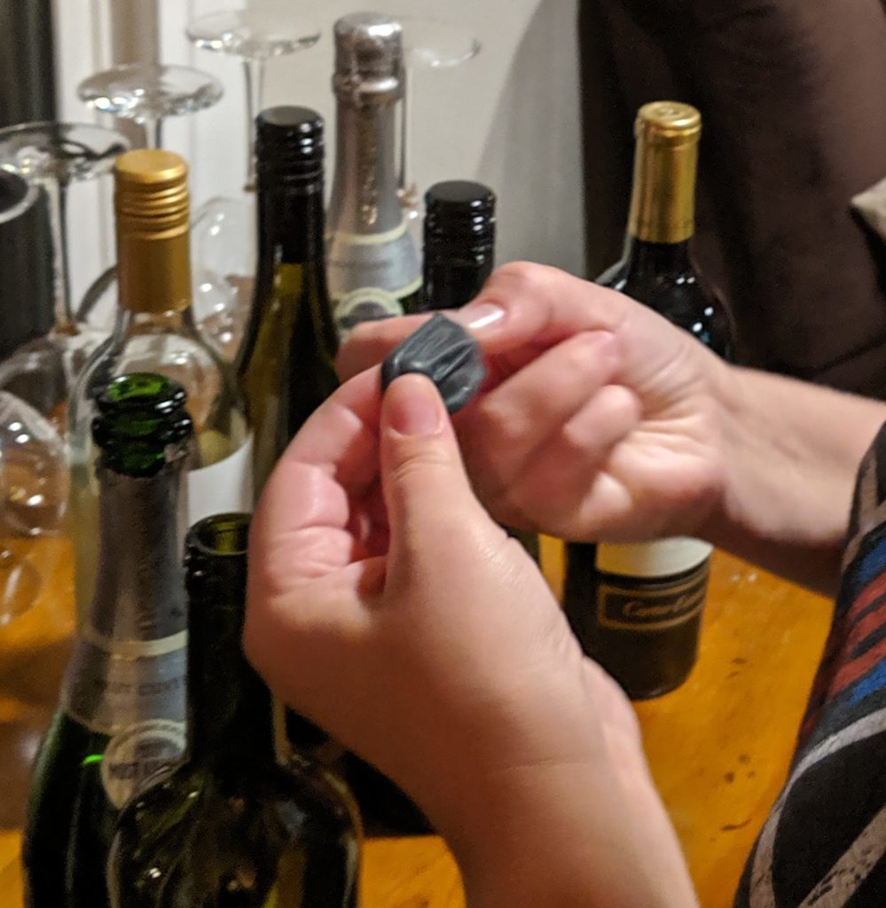 Putting a wine condom on a bottle